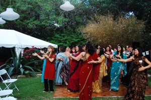 Caroline Boudreaux and Jasdeep Sandhu teaching the TMF Ambassadors Bollywood dance steps in preparation for the evening’s entertainment.