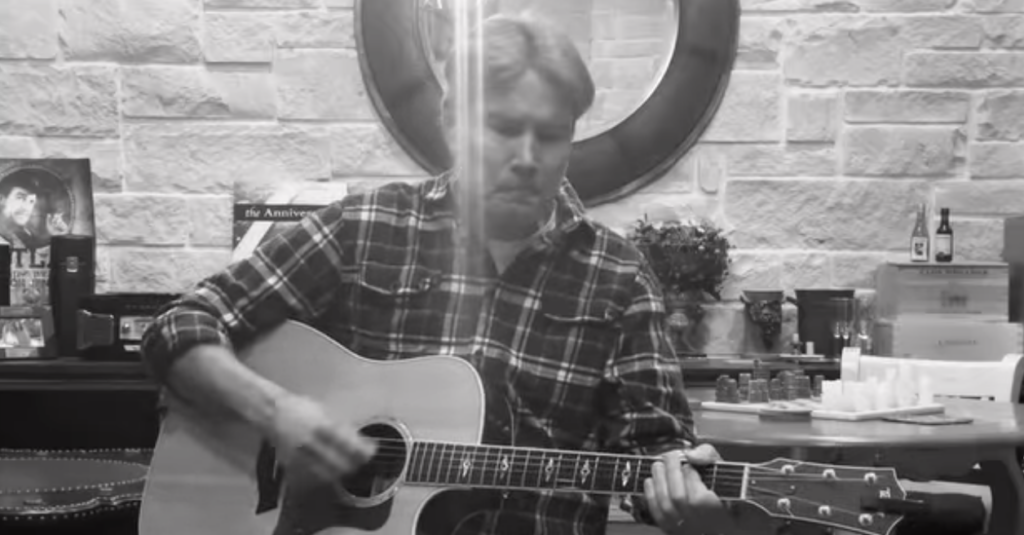 Louie singing a Christmas Carol to kick off Carols for Tots fundraiser