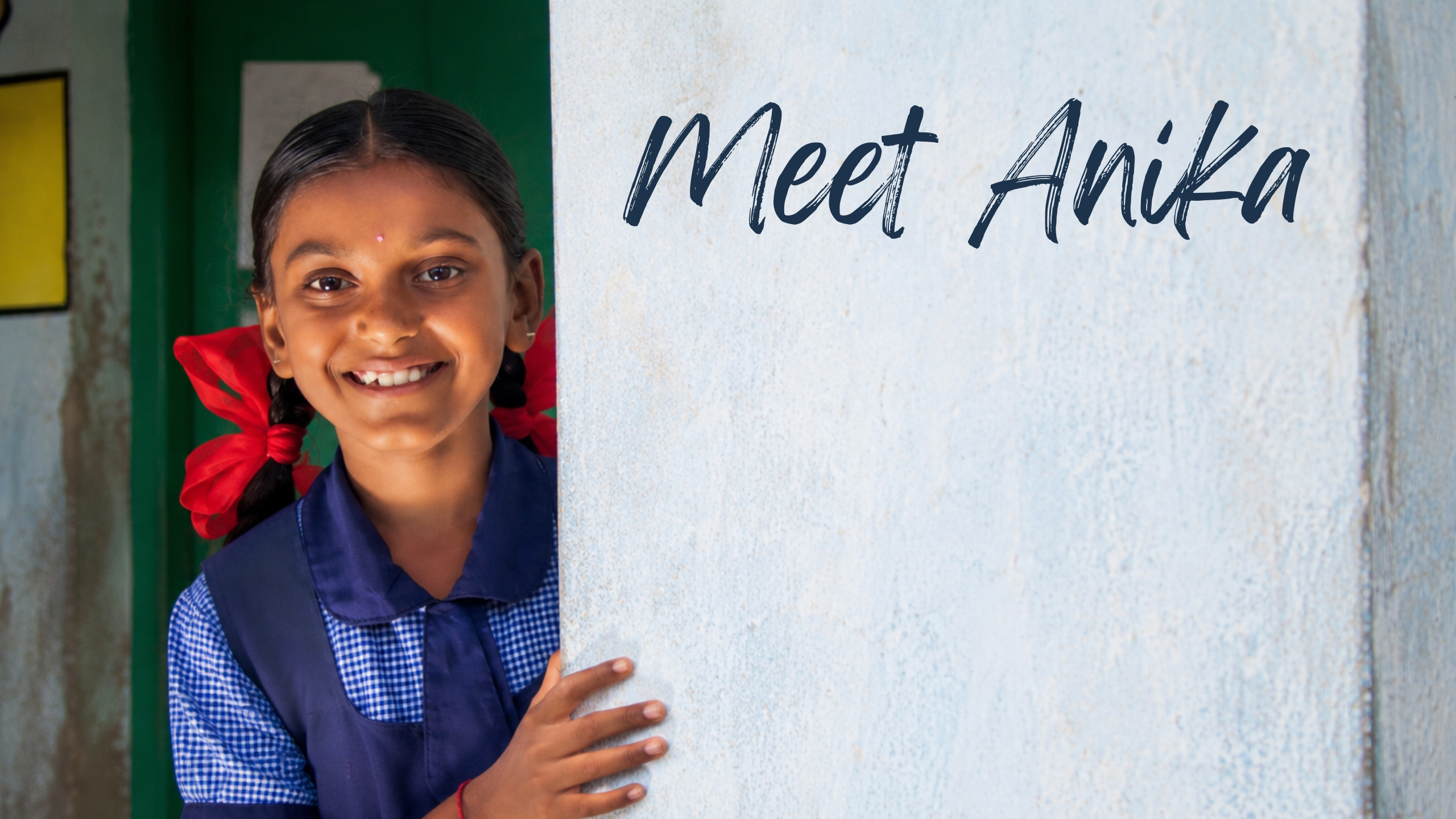 Anika peering around a wall in her school uniform